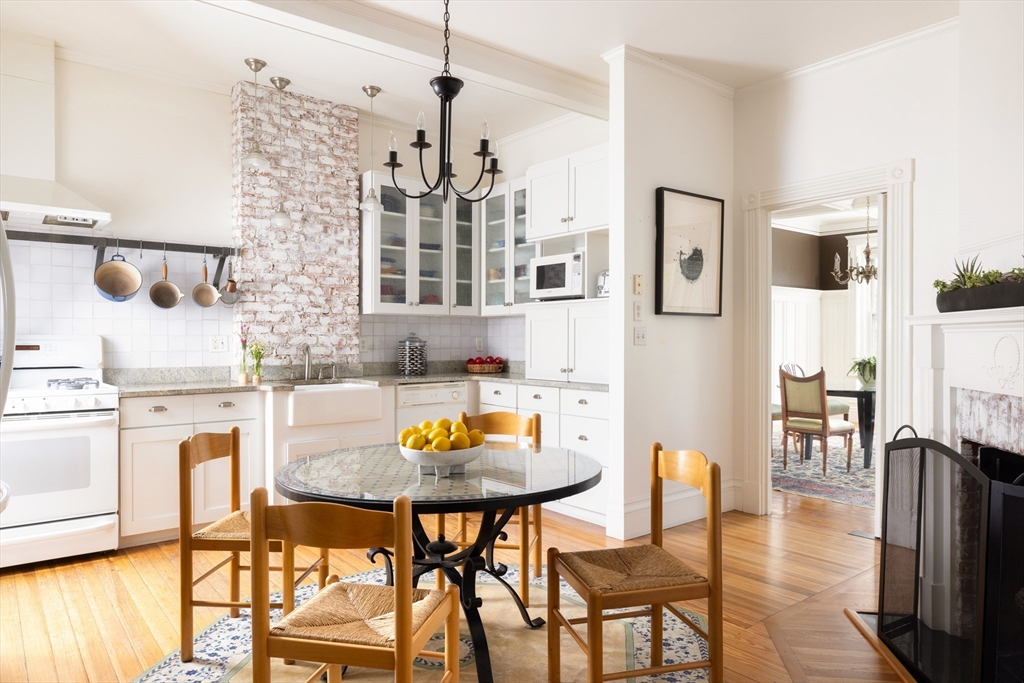 487 Boylston Street, Unit 3 Brookline, MA 02445 - Photo 6 of 14 a view of a dining room with furniture and wooden floor