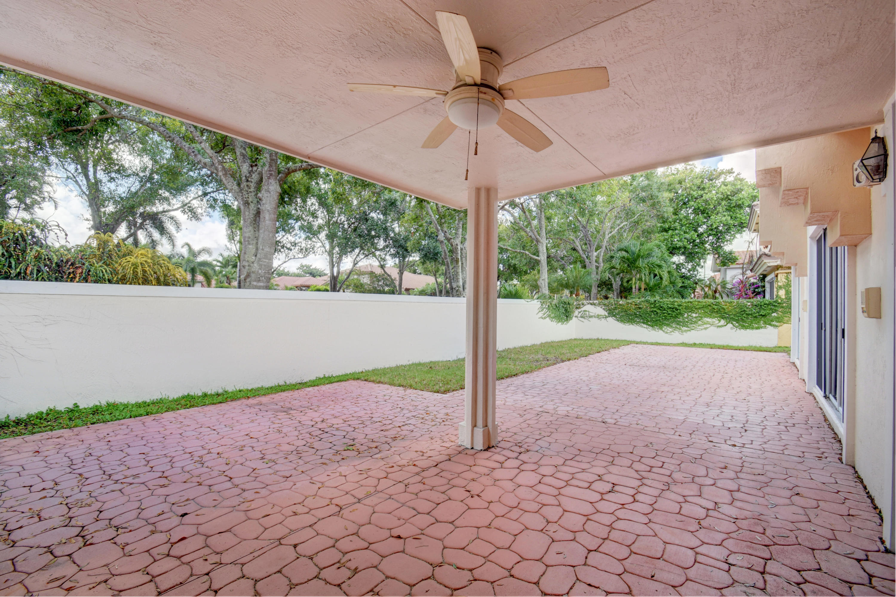 6286 Northwest 23rd Road Boca Raton, FL 33434 - Photo 33 of 44 a view of a room with porch and a backyard