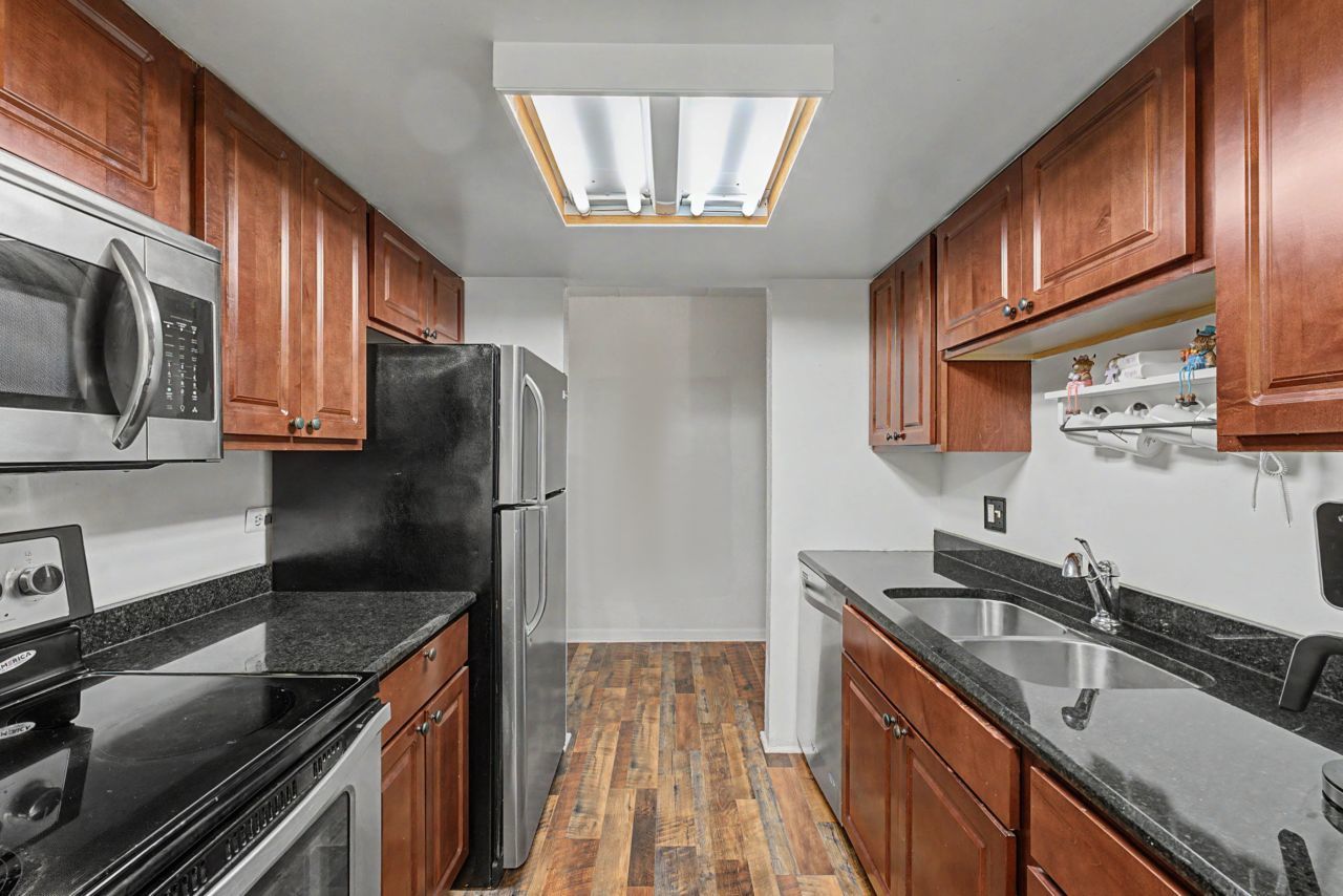 1 Renaissance Place, Unit 1105 Palatine, IL 60067 - Photo 11 of 21 a kitchen with stainless steel appliances granite countertop a sink stove and refrigerator