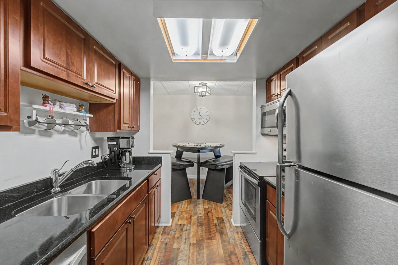 1 Renaissance Place, Unit 1105 Palatine, IL 60067 - Photo 12 of 21 a kitchen with granite countertop a sink appliances cabinets and furniture