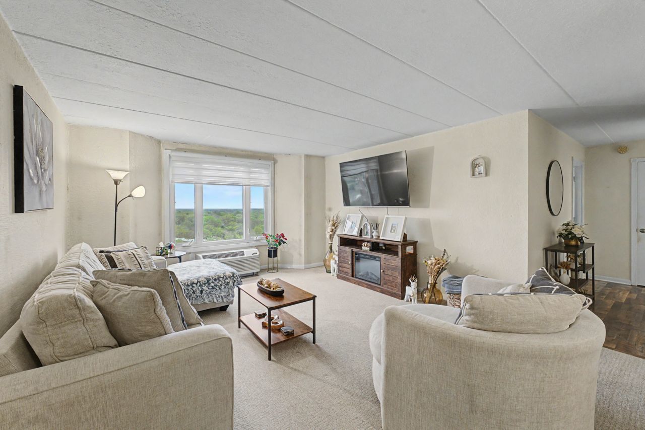 1 Renaissance Place, Unit 1105 Palatine, IL 60067 - Photo 6 of 21 a living room with furniture and a large window