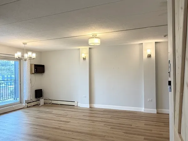 a view of a livingroom with wooden floor