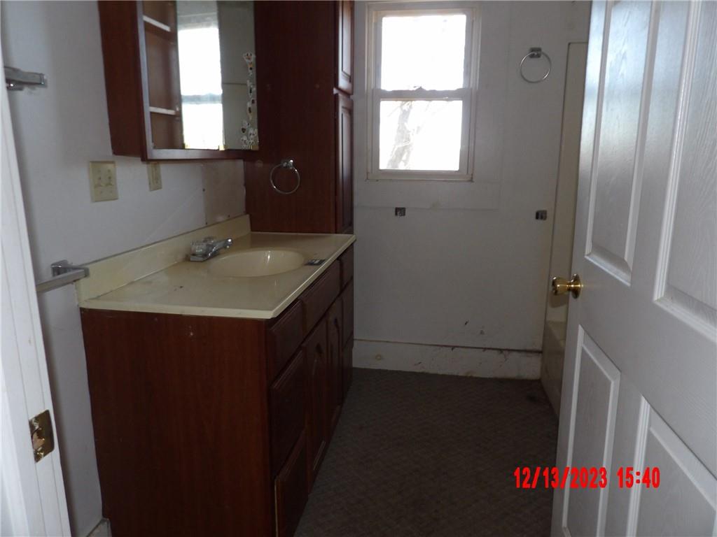 935 Mercer Grove City Road Mercer, PA 16137 - Photo 12 of 17 a bathroom with a sink and a mirror