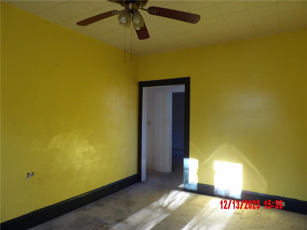 935 Mercer Grove City Road Mercer, PA 16137 - Photo 8 of 17 a view of a room with a window and a ceiling fan
