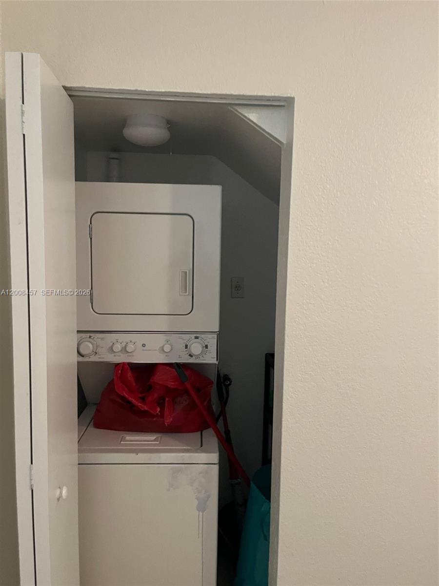 403 Northwest 84th Street, Unit 403 Miami, FL 33150 - Photo 3 of 5 a utility room with dryer and washer
