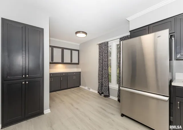 a kitchen with stainless steel appliances a refrigerator and a sink