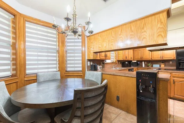 a living room with dining table and wooden floor