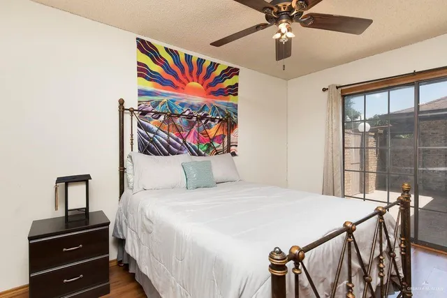 a bedroom with a bed and dresser