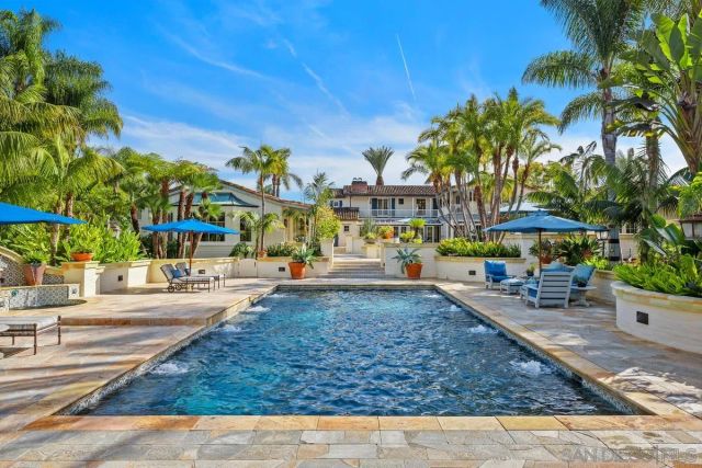 a view of a swimming pool with an outdoor seating