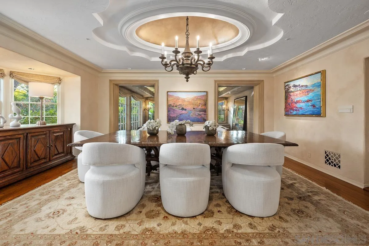 16337 Los Arboles Rancho Santa Fe, CA 92067 - Photo 19 of 31 a living room with furniture a chandelier and wooden floor
