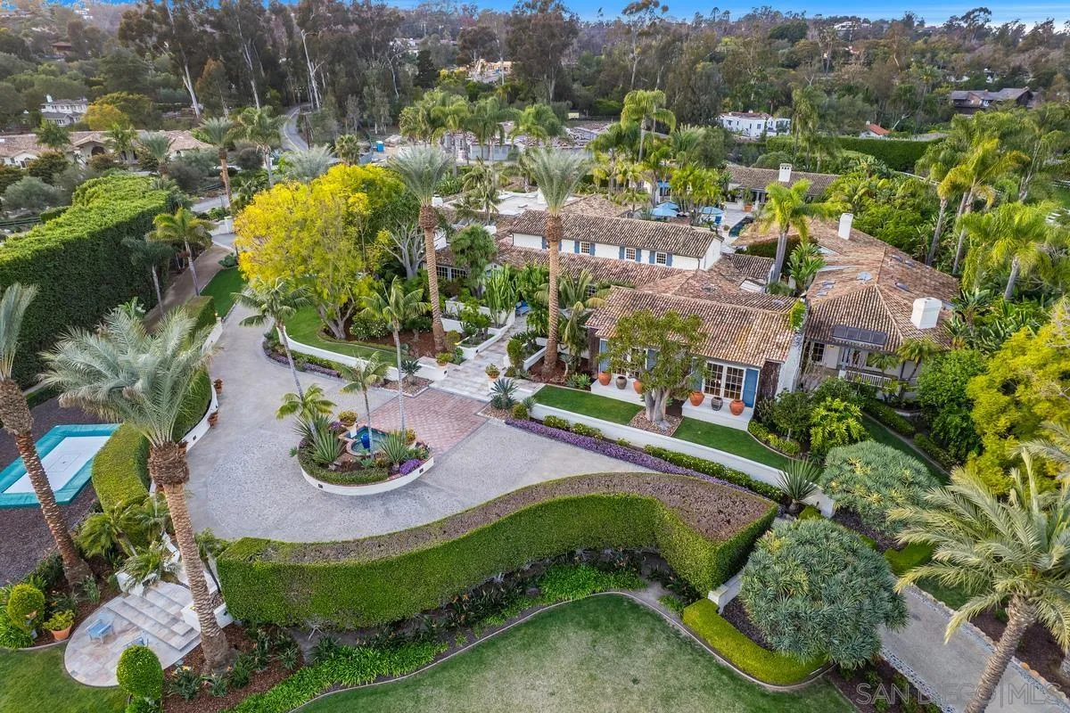 16337 Los Arboles Rancho Santa Fe, CA 92067 - Photo 2 of 31 a view of a swimming pool with a yard