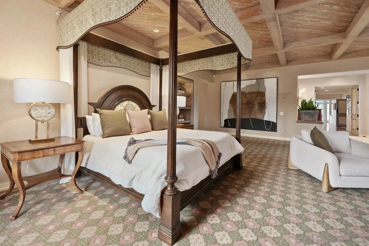 16337 Los Arboles Rancho Santa Fe, CA 92067 - Photo 26 of 31 a bedroom with a bed a mirror and lamp