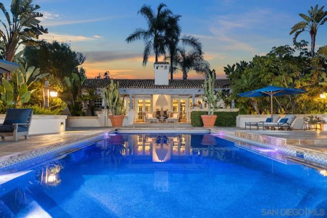 a view of swimming pool with chairs