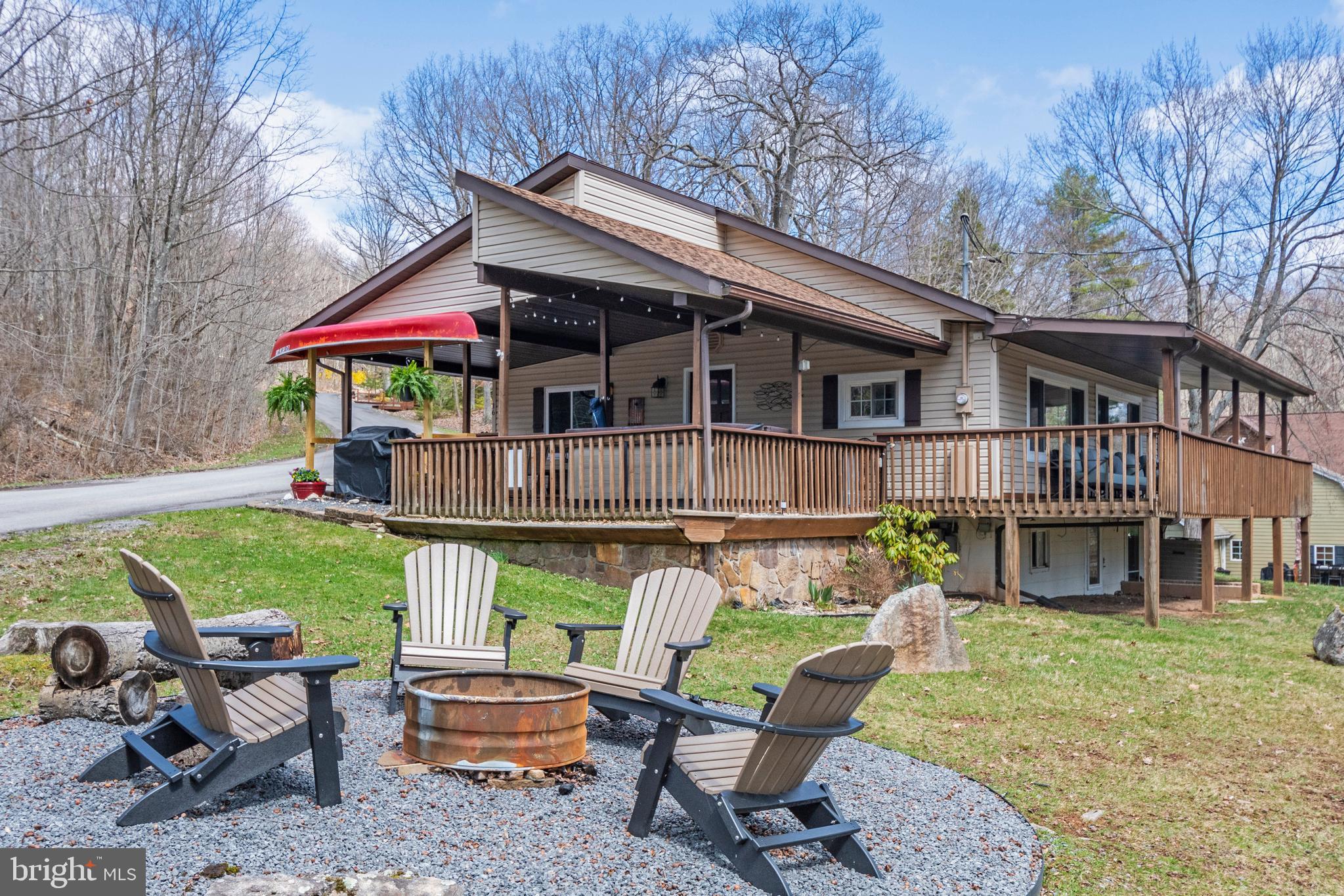a backyard of a house with barbeque oven table and chairs