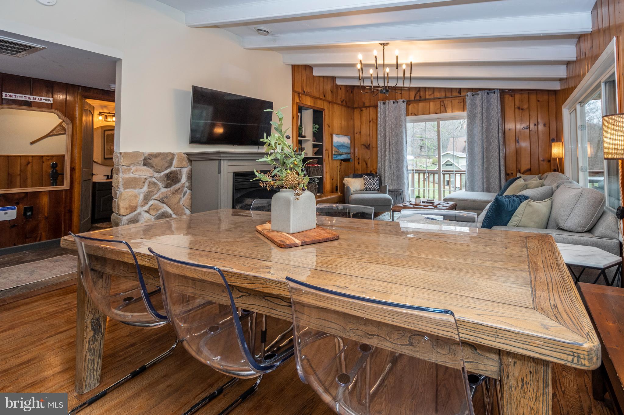 16 Jrs Drive McHenry, MD 21541 - Photo 24 of 57 a kitchen with a table chairs and a flat screen tv