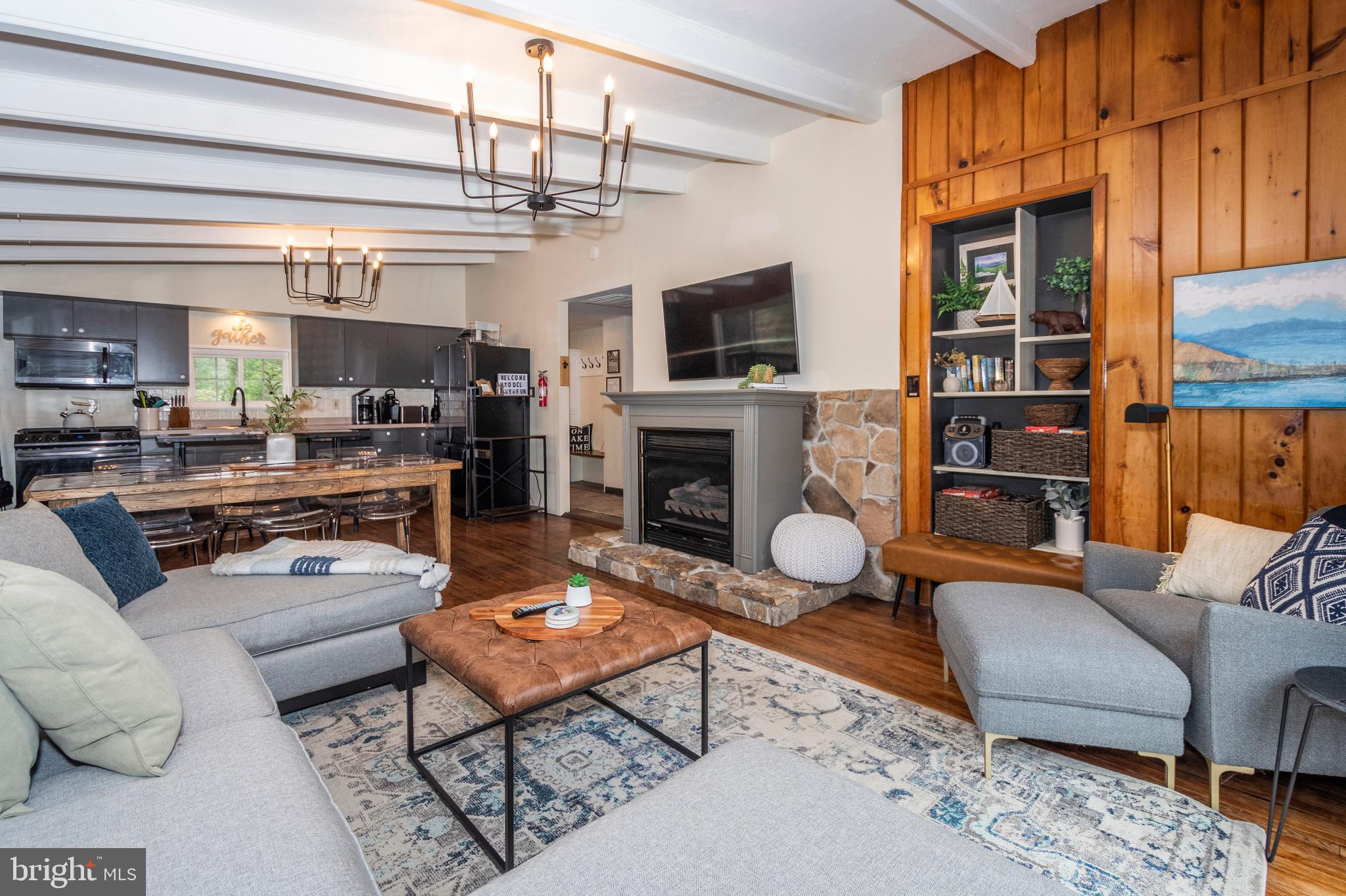 16 Jrs Drive McHenry, MD 21541 - Photo 33 of 57 a living room with furniture a flat screen tv and kitchen view