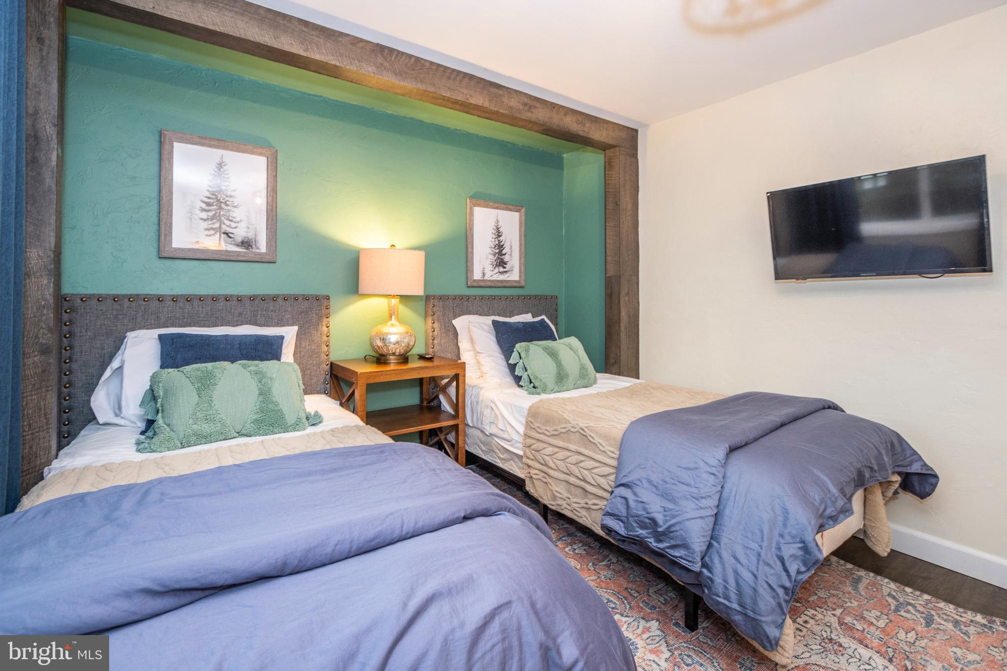 16 Jrs Drive McHenry, MD 21541 - Photo 38 of 57 a bedroom with two beds and a flat screen tv