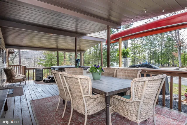 a view of a patio with wooden floor