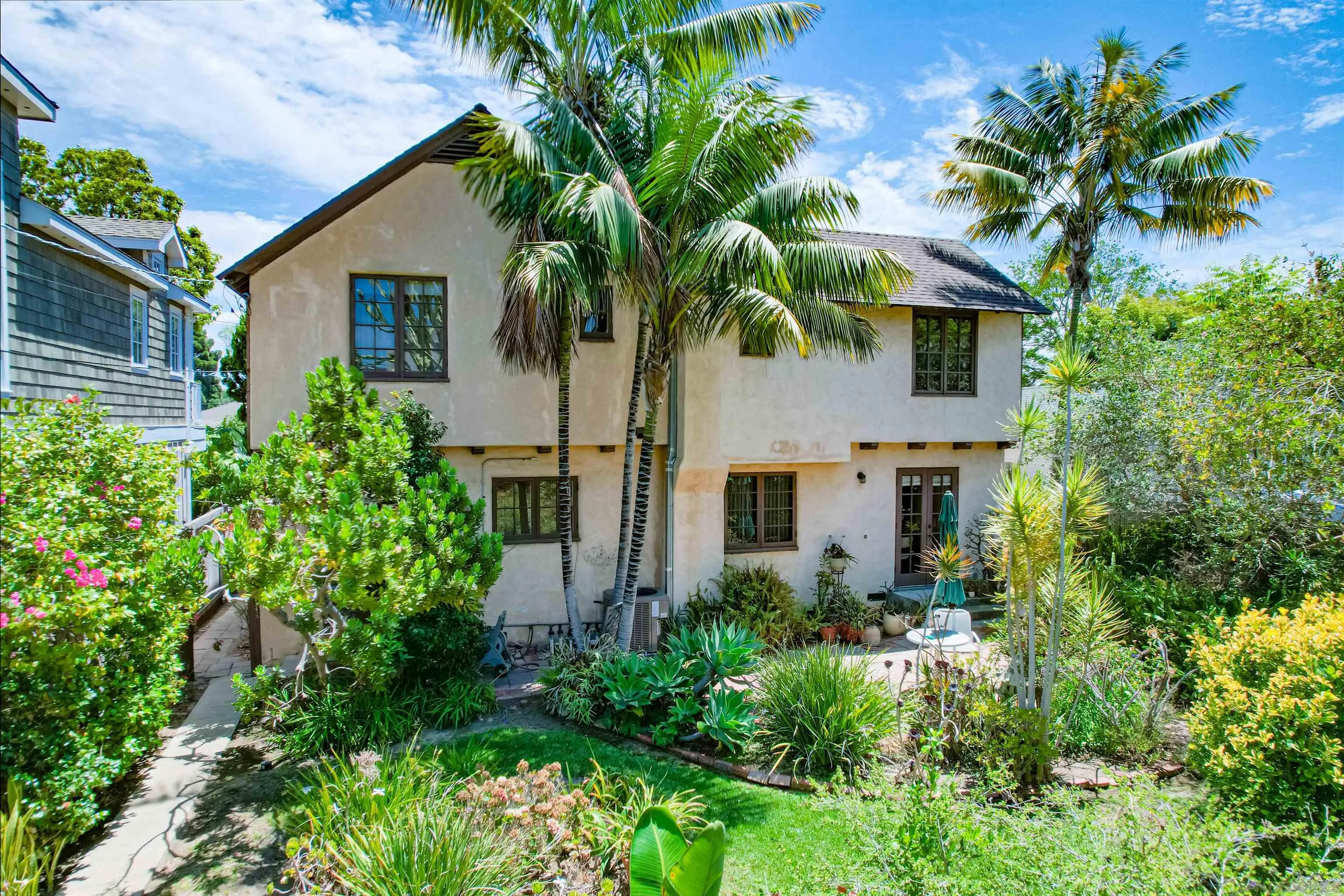 340 B Avenue Coronado, CA 92118 - Photo 2 of 31 a front view of house with yard and trees