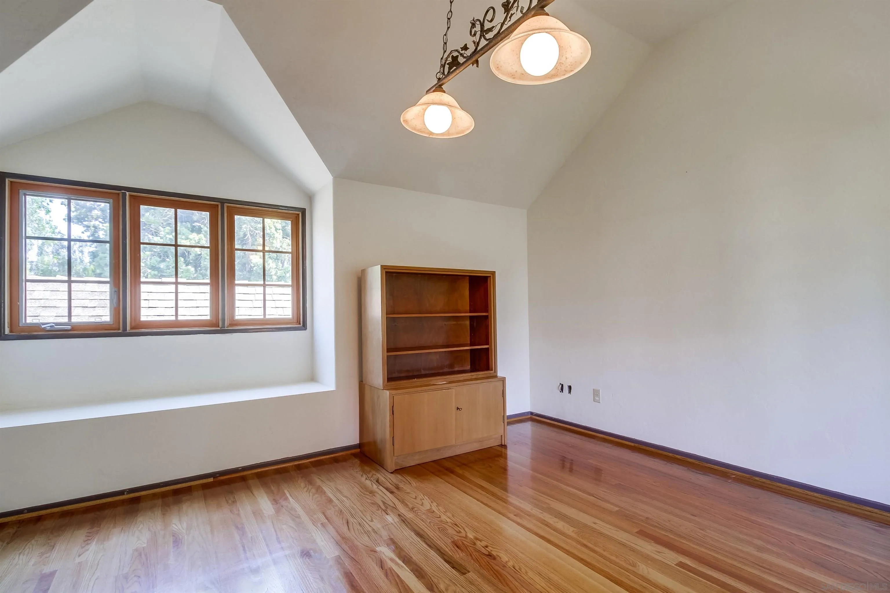 340 B Avenue Coronado, CA 92118 - Photo 23 of 31 an empty room with wooden floor and windows