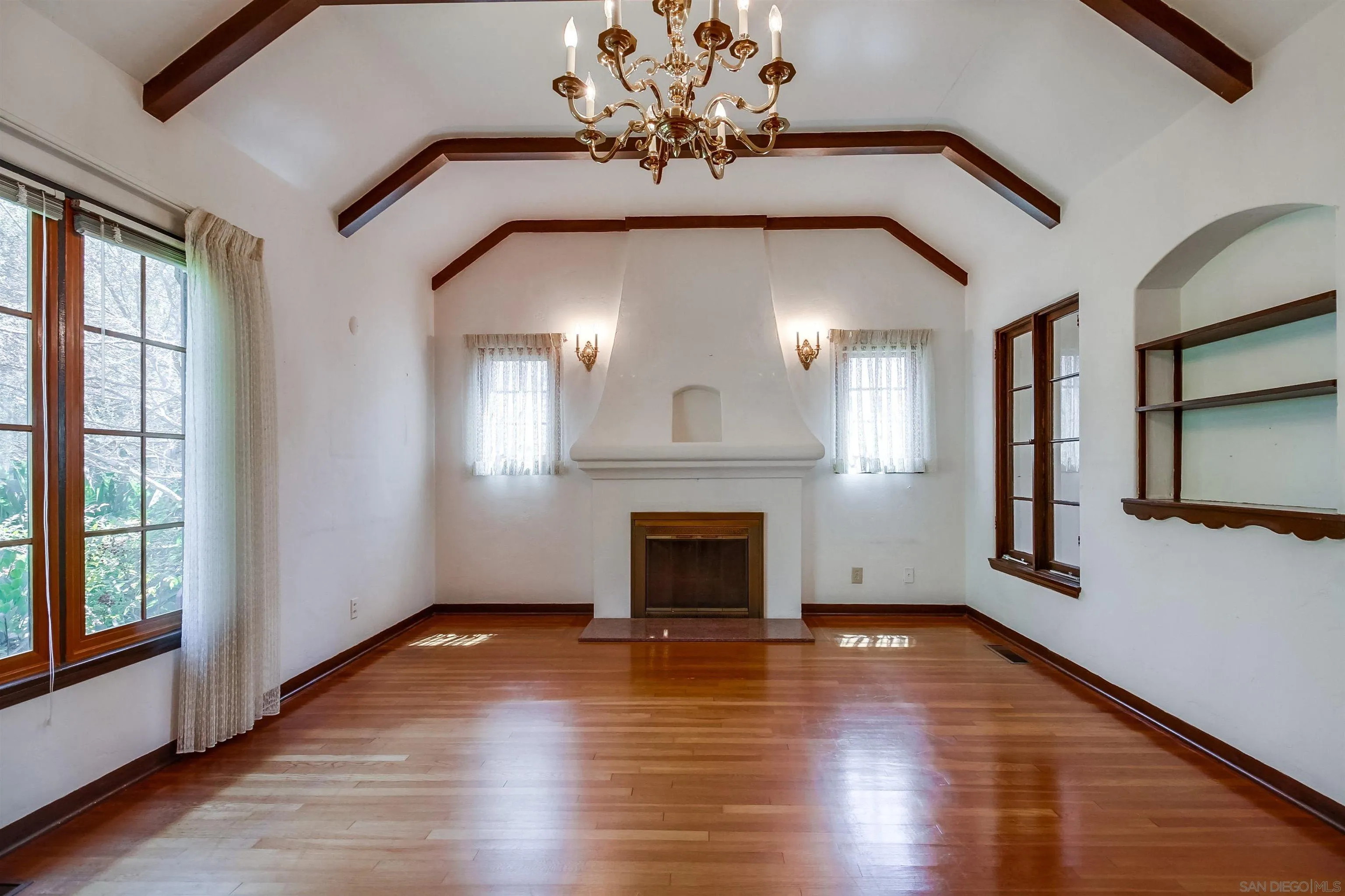 340 B Avenue Coronado, CA 92118 - Photo 5 of 31 a view of an empty room with wooden floor and a window