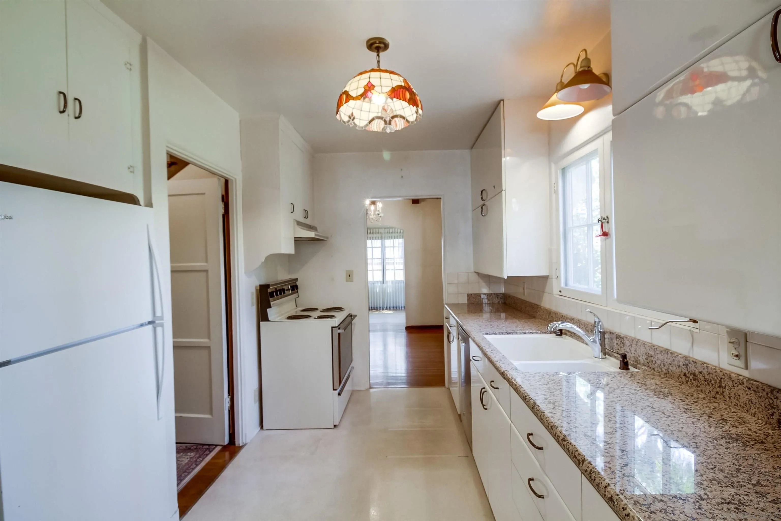 340 B Avenue Coronado, CA 92118 - Photo 10 of 31 a large kitchen with stainless steel appliances granite countertop a sink and a refrigerator