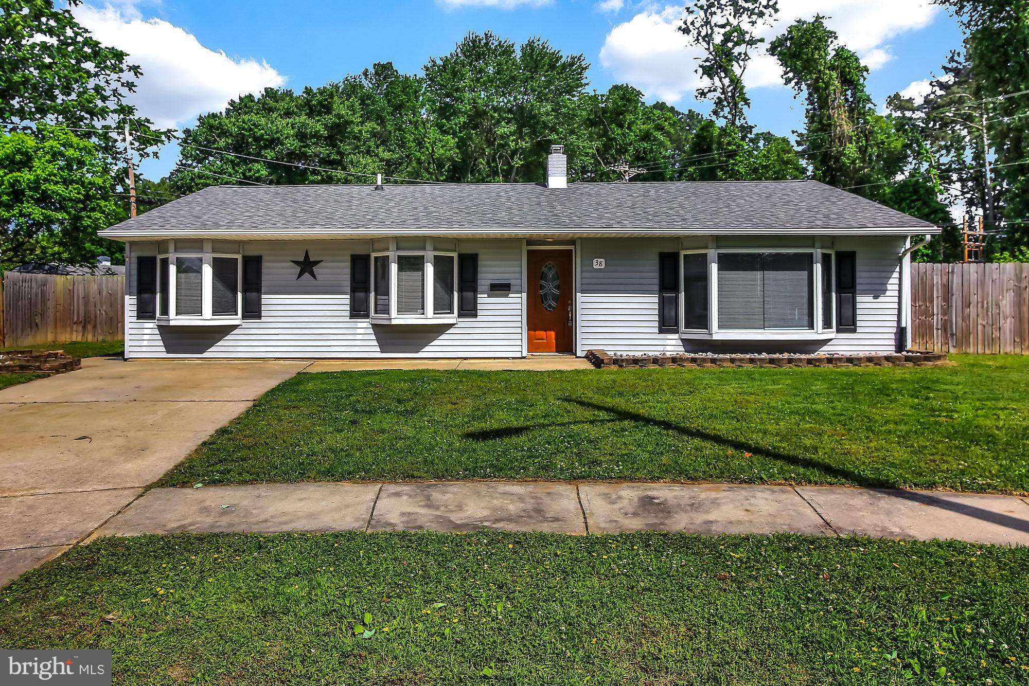 38 Kollman Drive Newark, DE 19713 - Photo 1 of 23 a front view of a house with a yard and trees