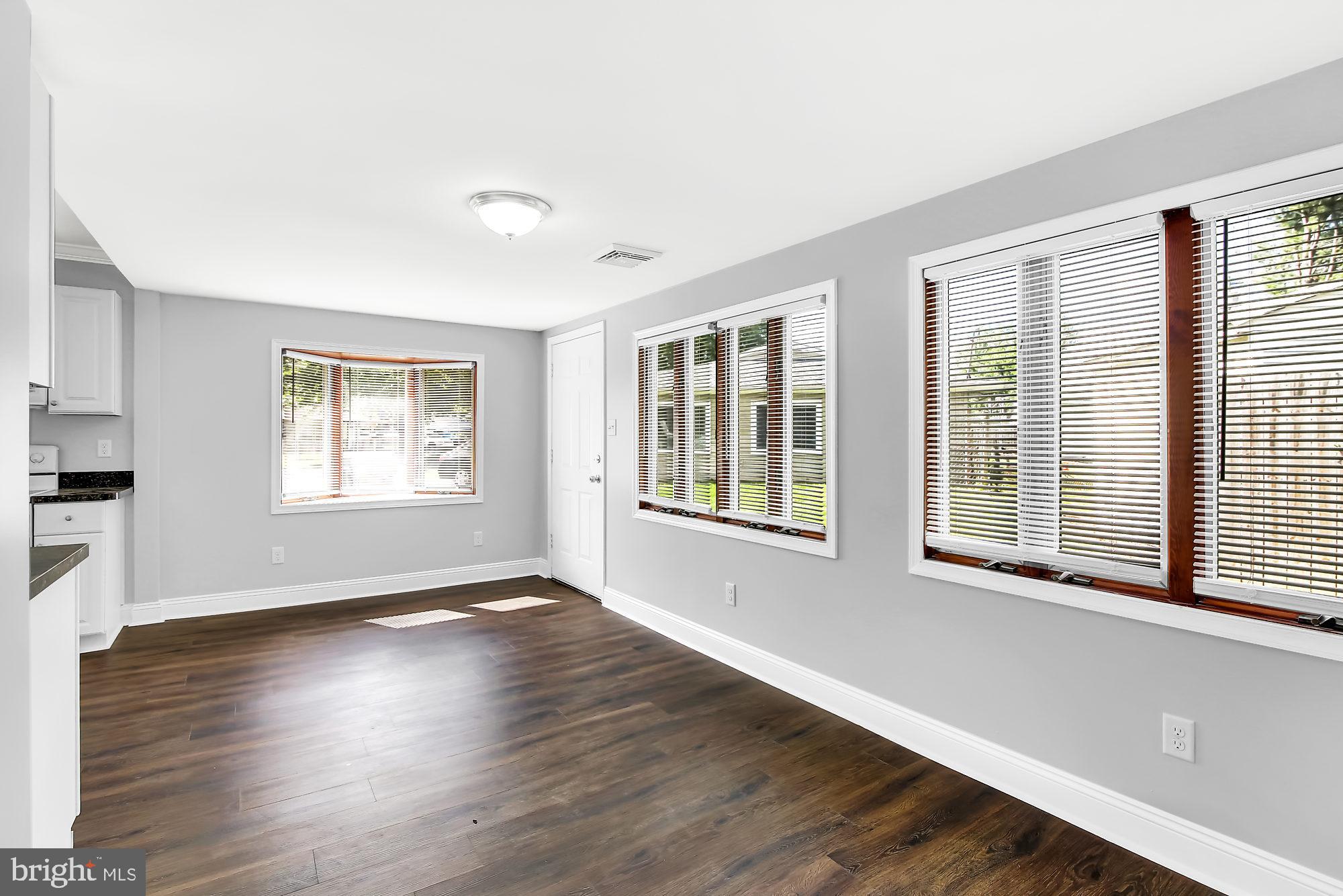 38 Kollman Drive Newark, DE 19713 - Photo 9 of 23 a view of an empty room with wooden floor and a window