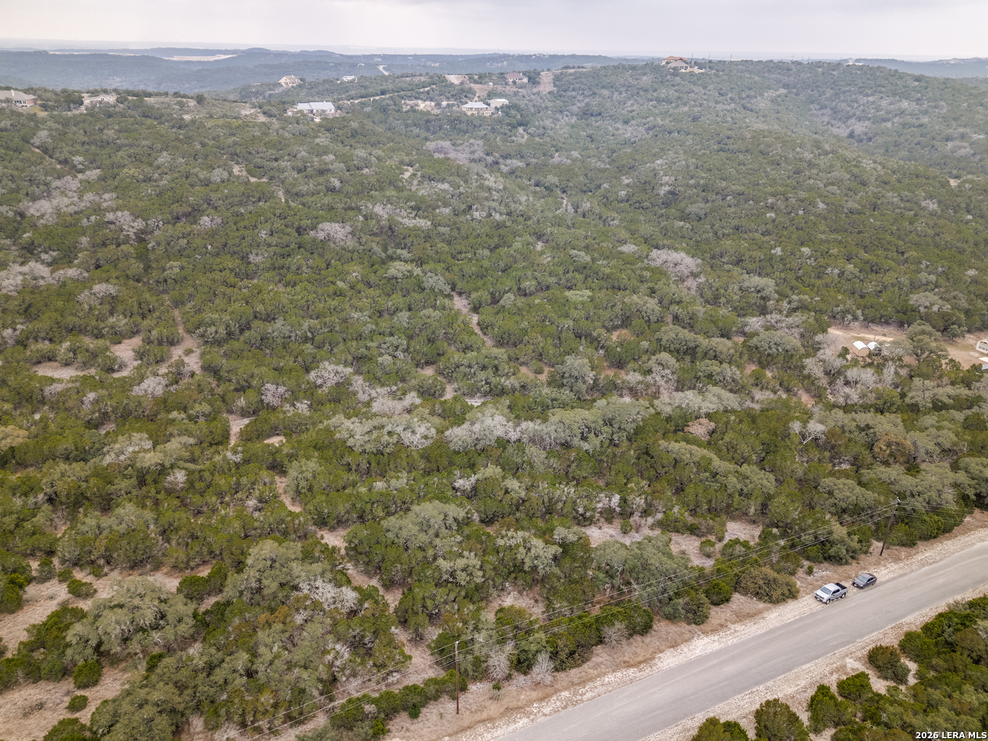 Cr 2763-lot 439 Bear Spring Ranch Mico, TX 78056 - Photo 3 of 9 a view of a field with a mountain in the background