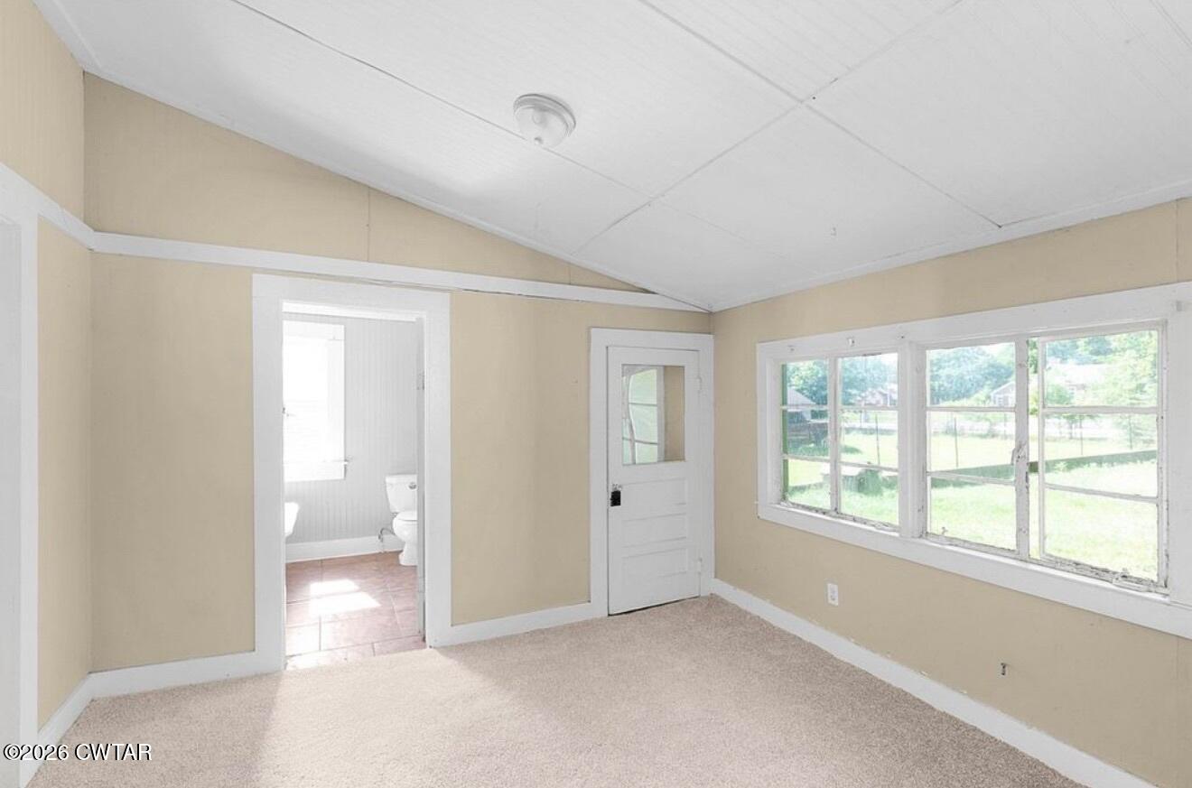 125 Williams Street Jackson, TN 38301 - Photo 11 of 17 a view of an empty room with a window and bathroom