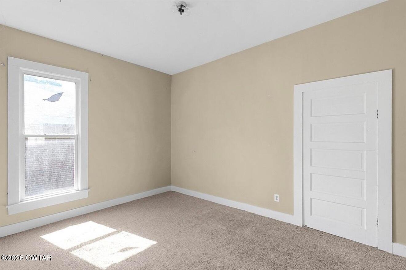 125 Williams Street Jackson, TN 38301 - Photo 12 of 17 an empty room with windows