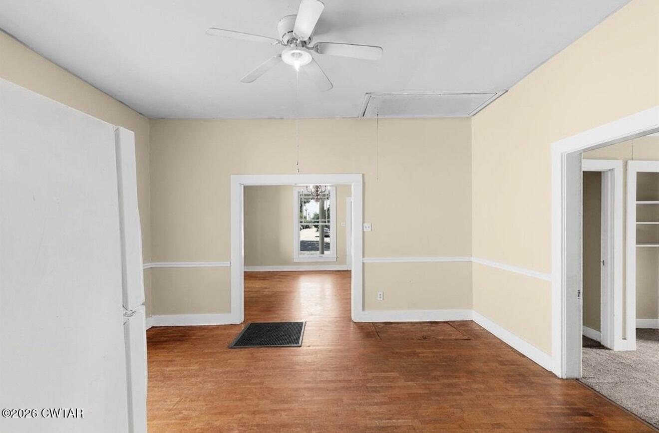 125 Williams Street Jackson, TN 38301 - Photo 9 of 17 a view of empty room with wooden floor and fan