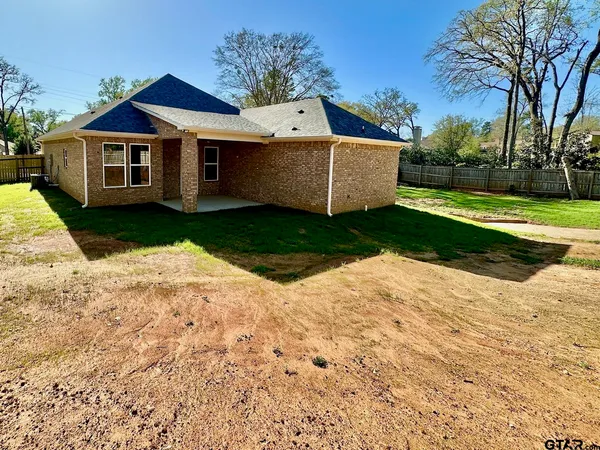 a front view of a house with yard
