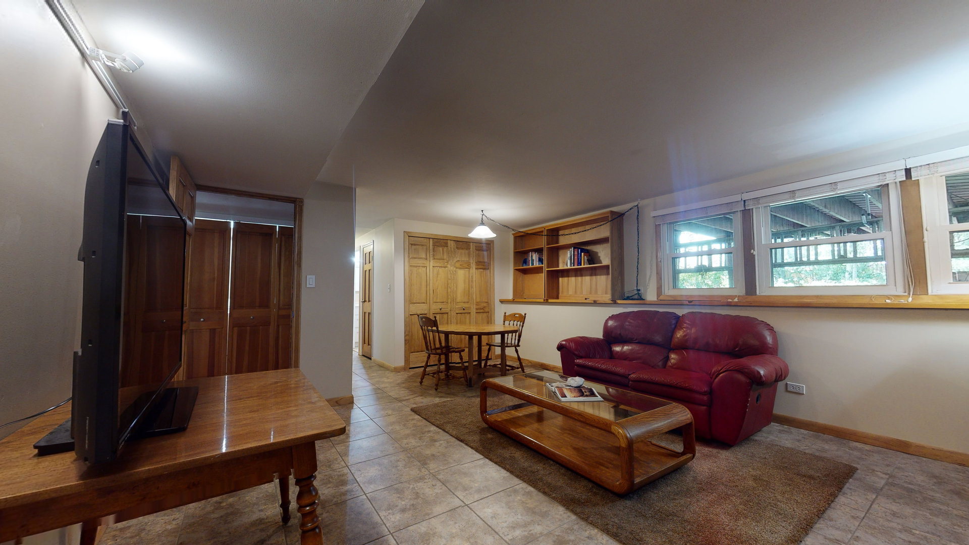 274 Timber Hill Road Buffalo Grove, IL 60089 - Photo 15 of 22 a living room with furniture a window and a flat screen tv