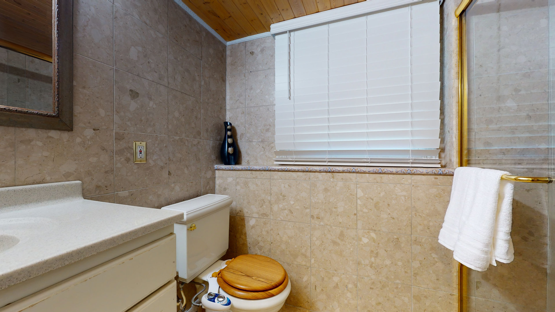 274 Timber Hill Road Buffalo Grove, IL 60089 - Photo 17 of 22 a bathroom with a sink a toilet and a window