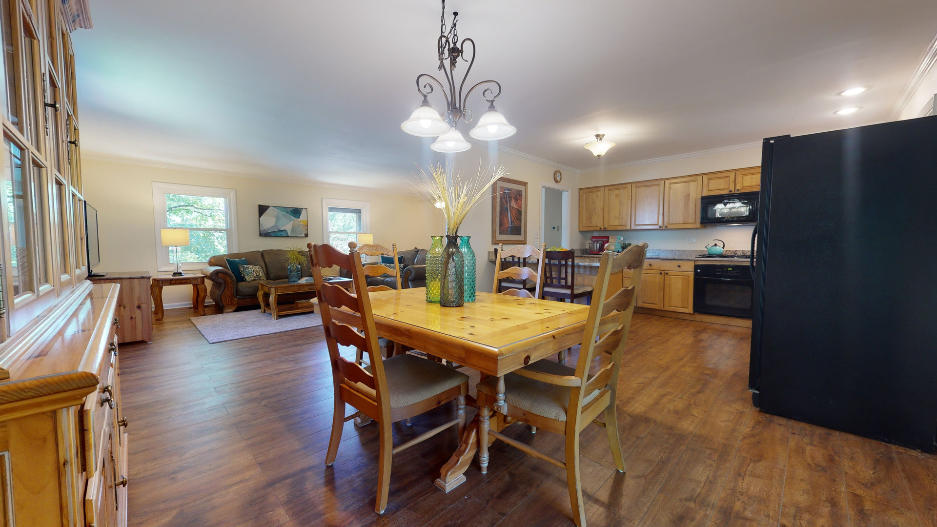 274 Timber Hill Road Buffalo Grove, IL 60089 - Photo 5 of 22 a dining room with stainless steel appliances kitchen island granite countertop a table chairs and a refrigerator