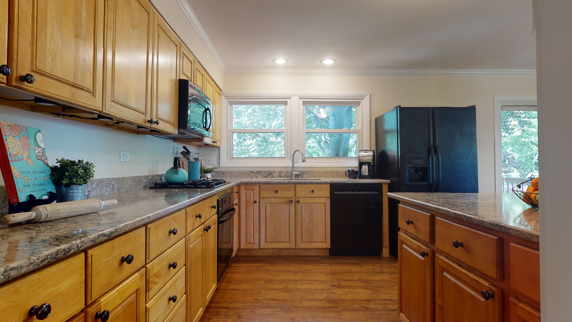 274 Timber Hill Road Buffalo Grove, IL 60089 - Photo 7 of 22 a kitchen with sink cabinets and window