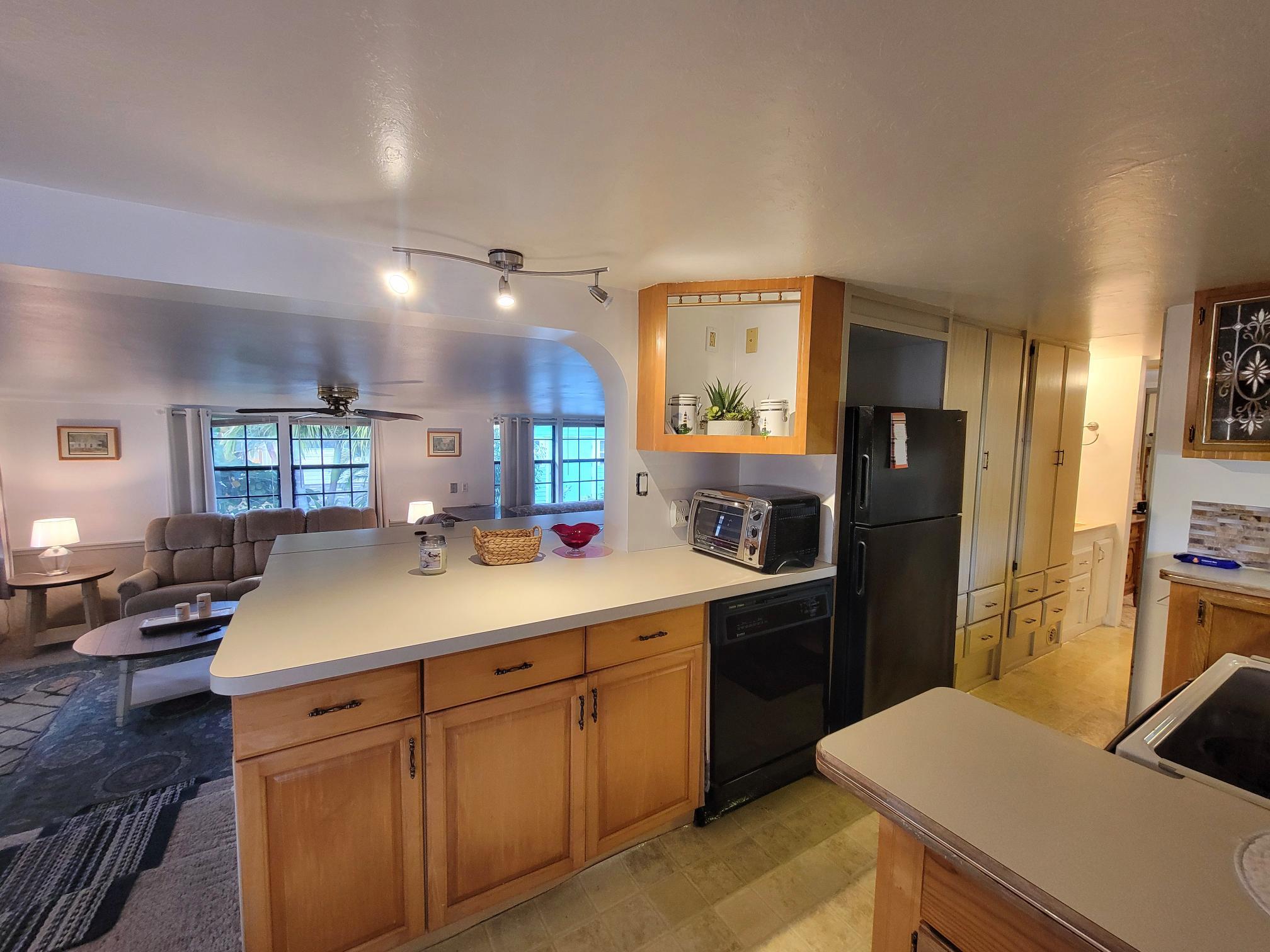 13690 Northwest 127th Terrace Okeechobee, FL 34974 - Photo 12 of 23 a kitchen with a sink appliances and cabinets