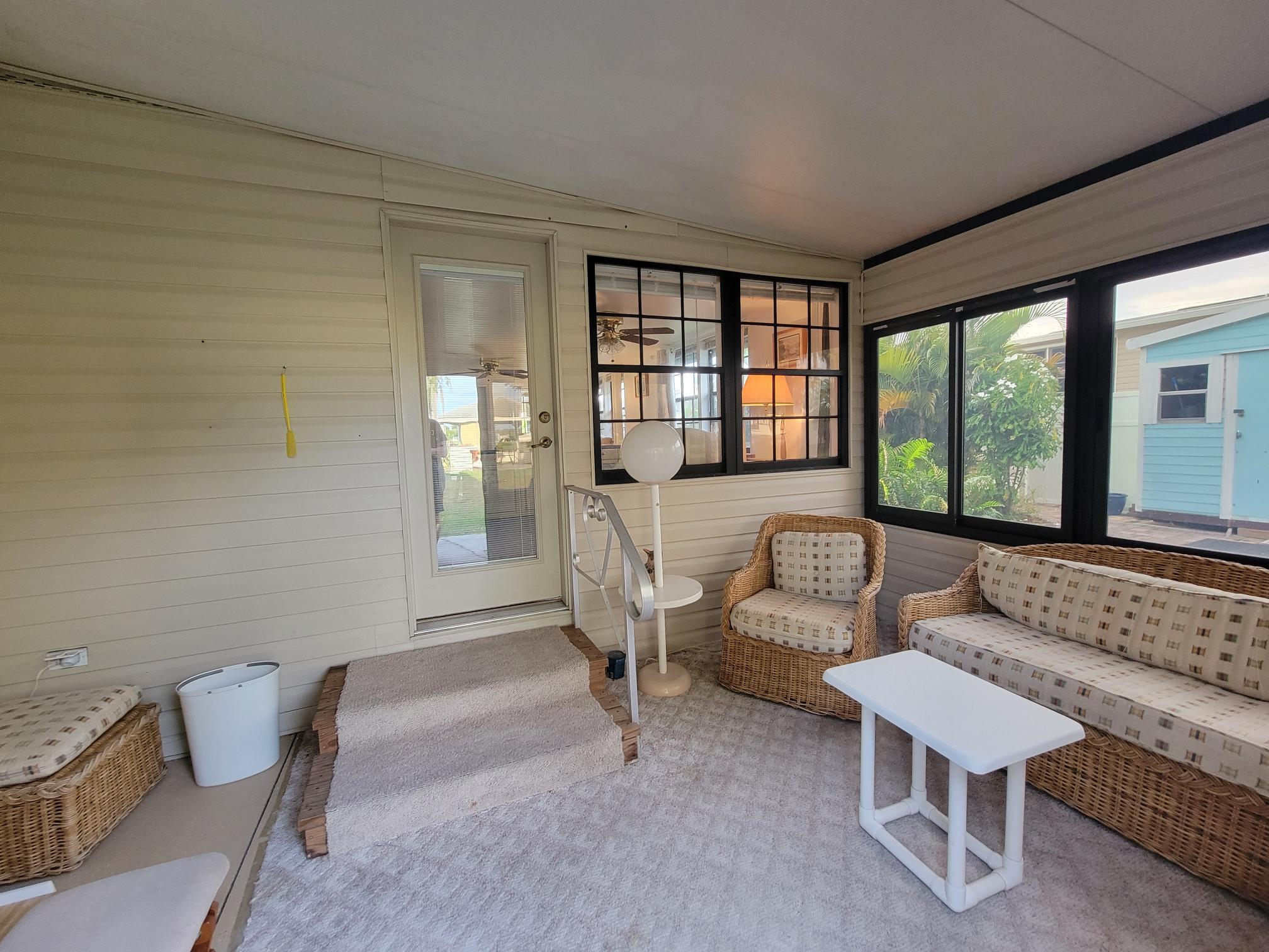 13690 Northwest 127th Terrace Okeechobee, FL 34974 - Photo 18 of 23 a living room with furniture and a large window