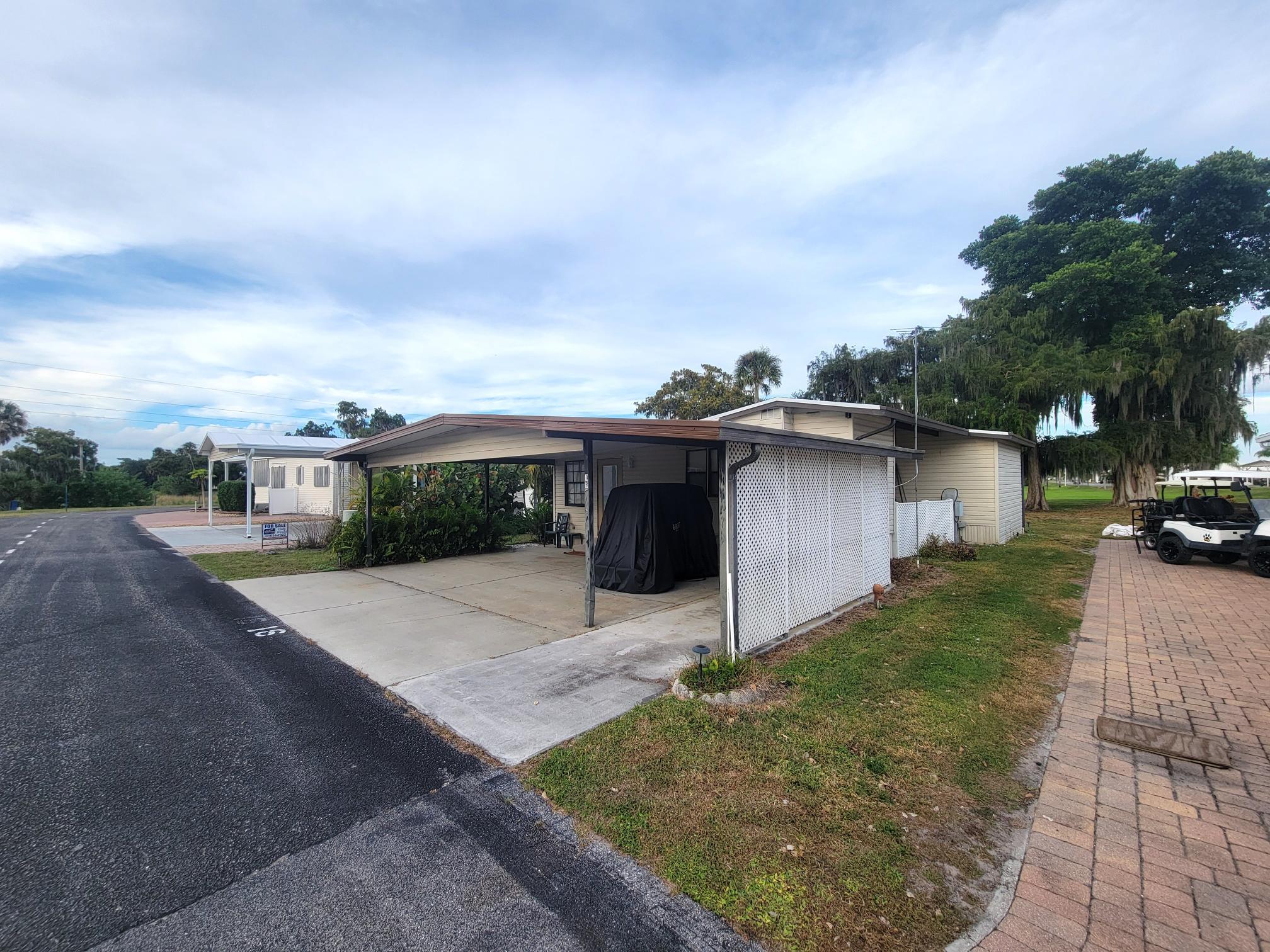 13690 Northwest 127th Terrace Okeechobee, FL 34974 - Photo 2 of 23 a view of a house with a yard