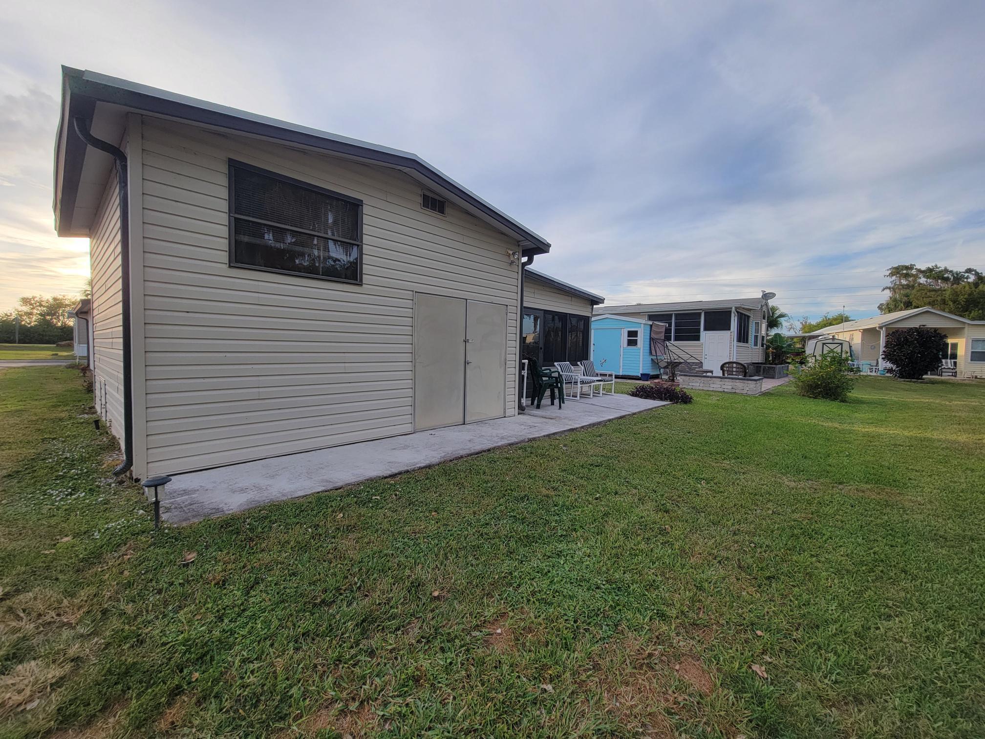 13690 Northwest 127th Terrace Okeechobee, FL 34974 - Photo 21 of 23 a view of a yard in front of house