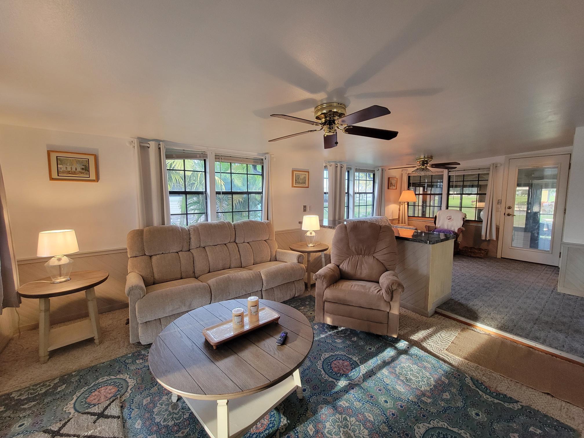 13690 Northwest 127th Terrace Okeechobee, FL 34974 - Photo 4 of 23 a living room with furniture and a large window