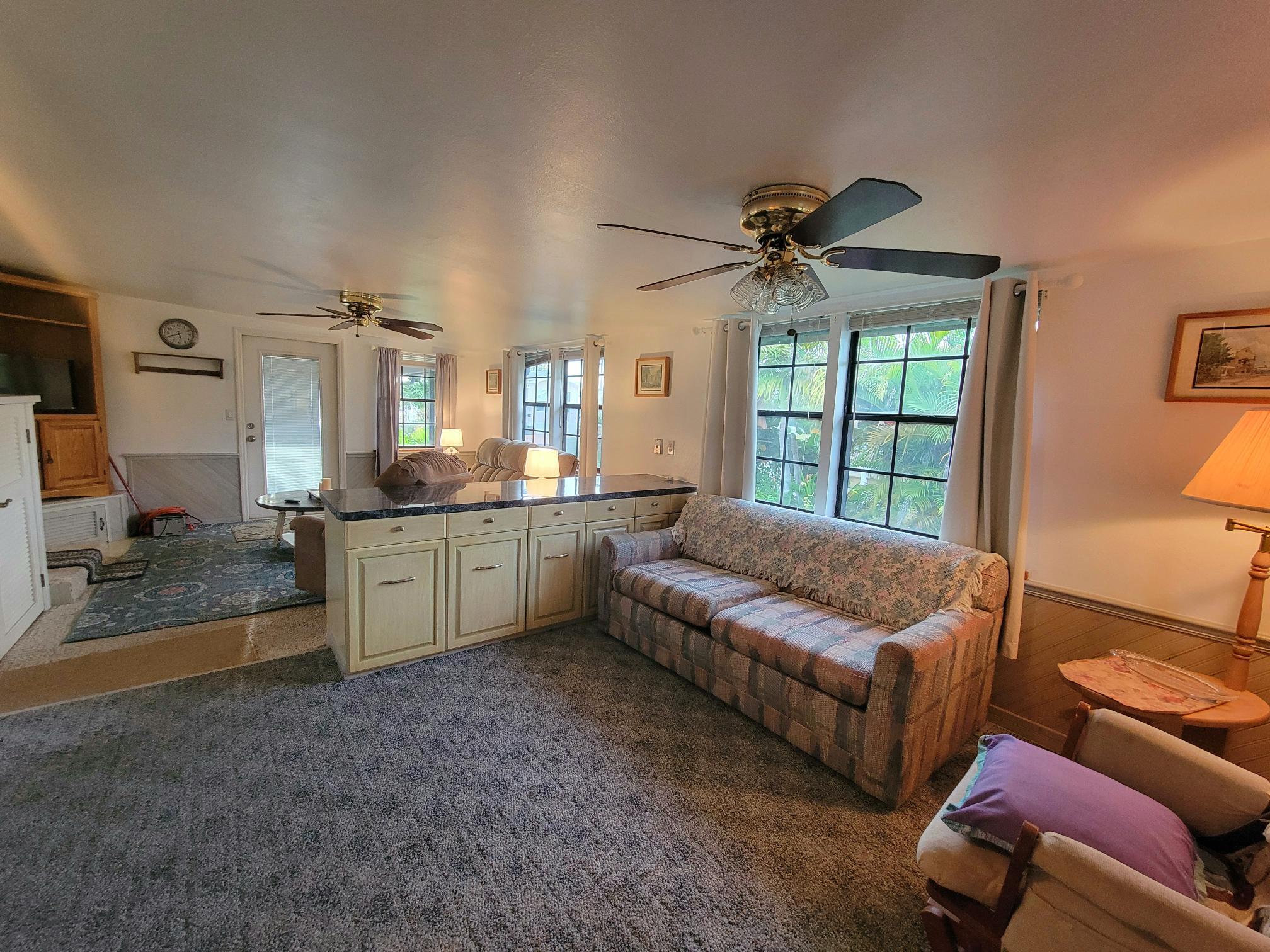 13690 Northwest 127th Terrace Okeechobee, FL 34974 - Photo 6 of 23 a living room with furniture and a large window