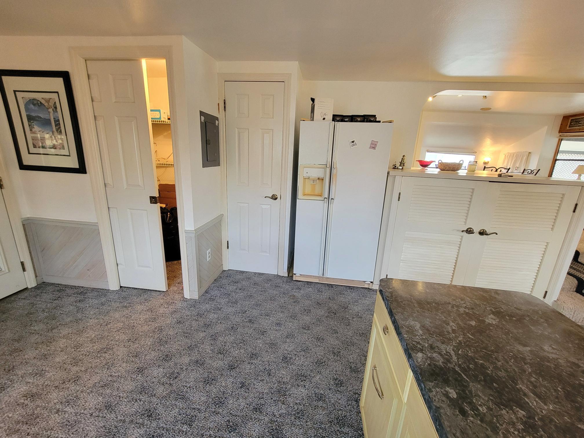 13690 Northwest 127th Terrace Okeechobee, FL 34974 - Photo 7 of 23 a view of a hallway to rooms and stairs