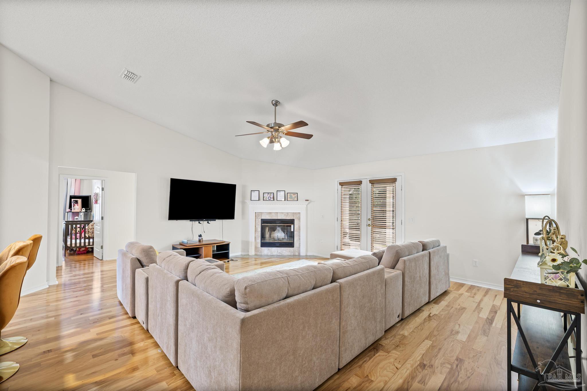 2165 Liberty Loop Road Cantonment, FL 32533 - Photo 14 of 51 a living room with furniture and a flat screen tv