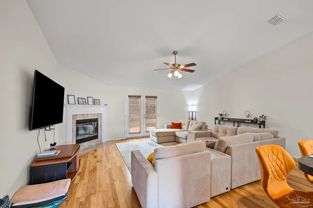 a living room with furniture and a flat screen tv