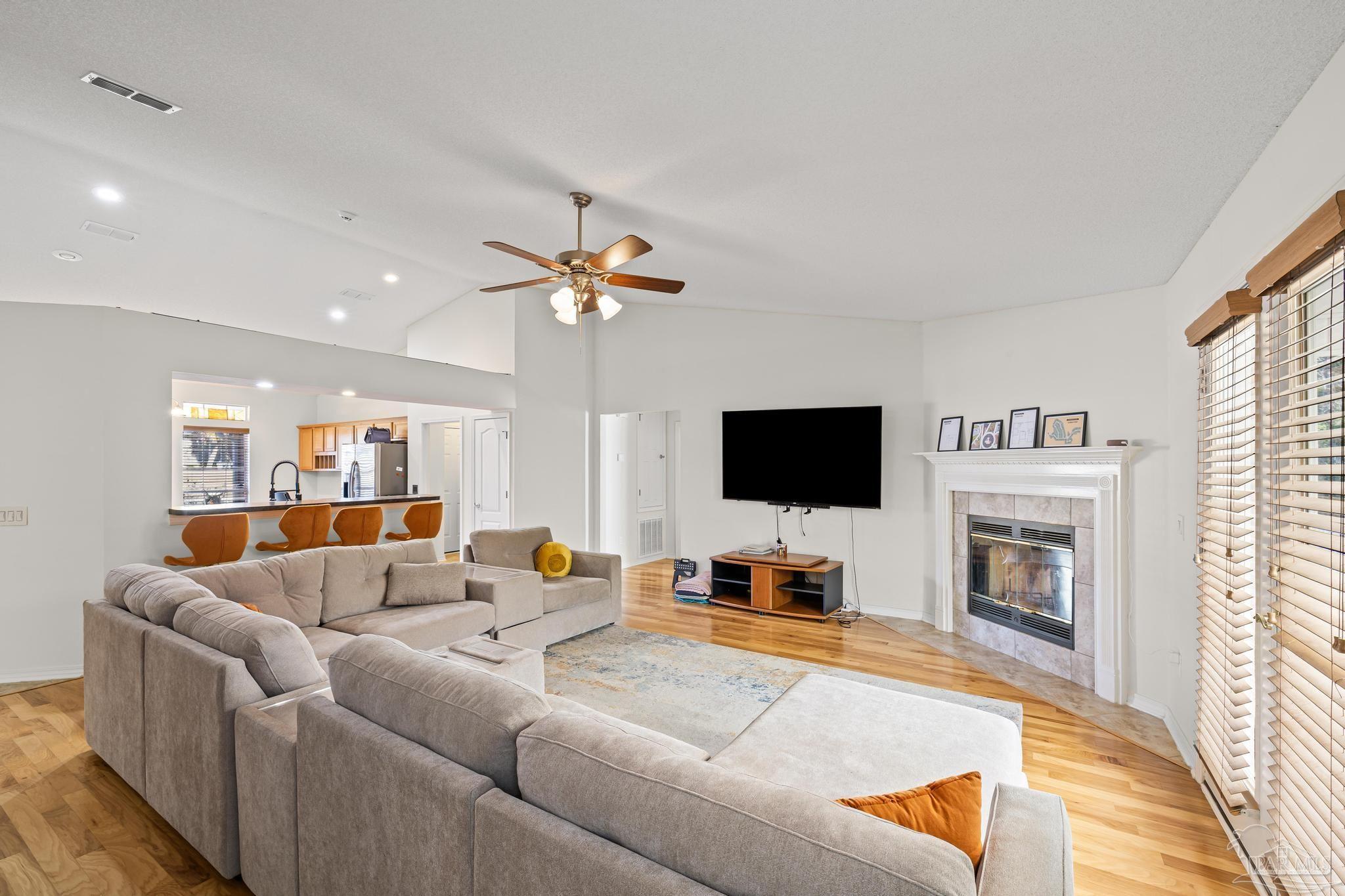 2165 Liberty Loop Road Cantonment, FL 32533 - Photo 16 of 51 a living room with furniture and a flat screen tv