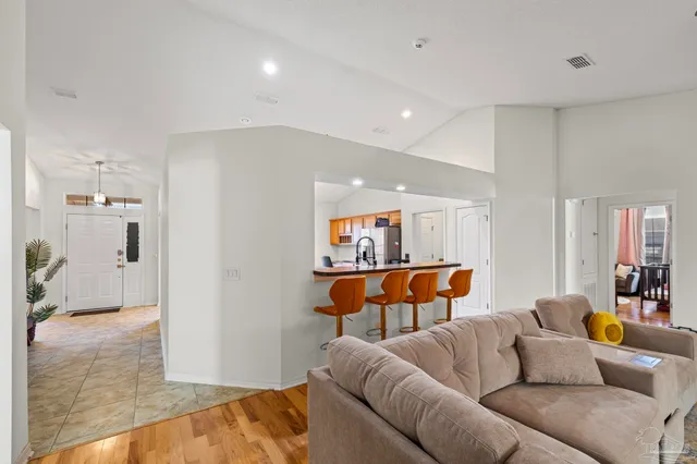 a view of a living room and kitchen