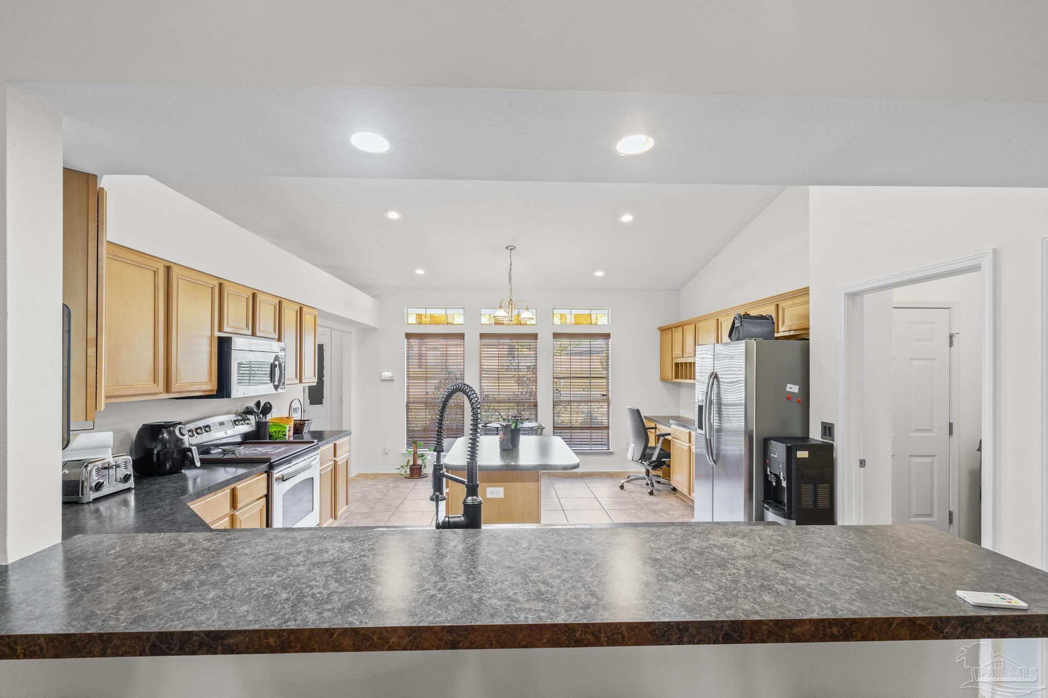 2165 Liberty Loop Road Cantonment, FL 32533 - Photo 18 of 51 a view of a living room and kitchen