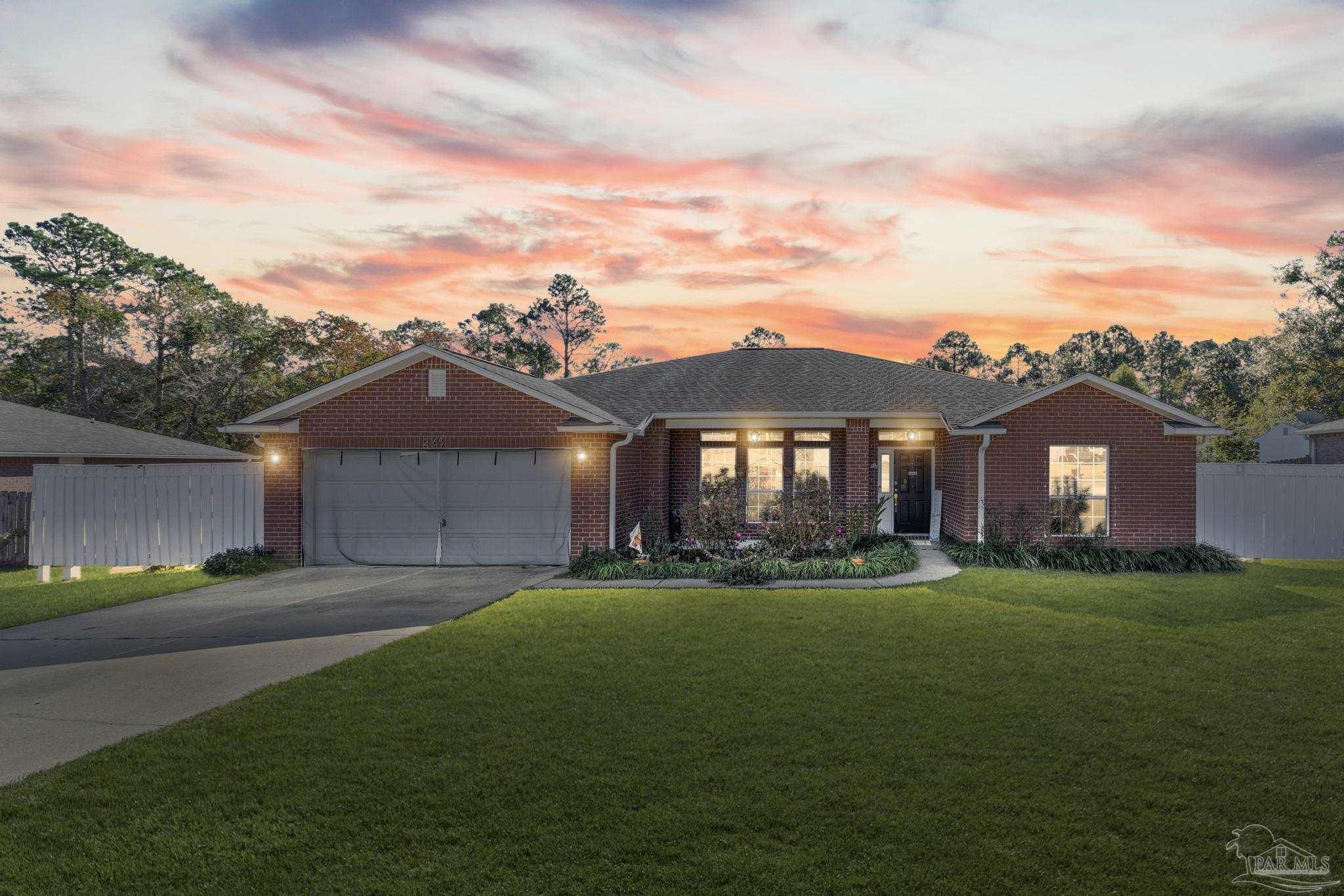 2165 Liberty Loop Road Cantonment, FL 32533 - Photo 2 of 51 a front view of a house with a yard